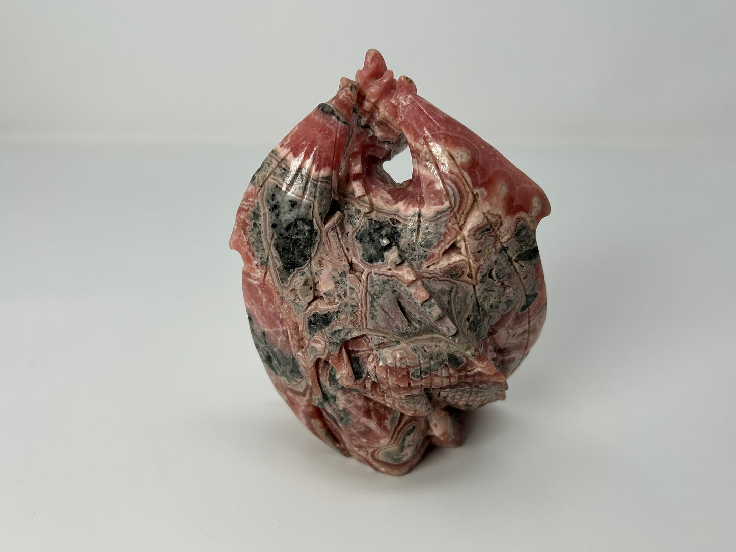Rhodochrosite Skull with Dragon (5", 127mm)