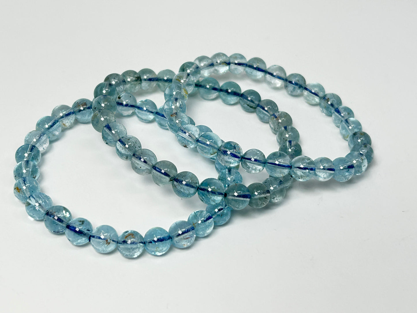 Blue Topaz Bracelets for meditation mindfulness and grounding on a white background