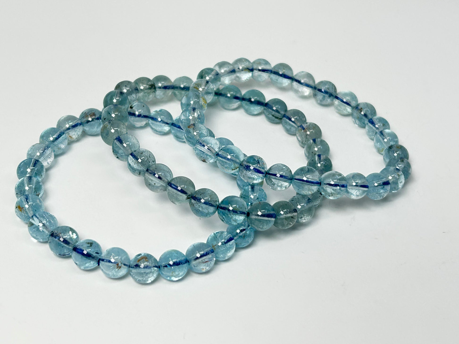 Blue Topaz Bracelets for meditation mindfulness and grounding on a white background