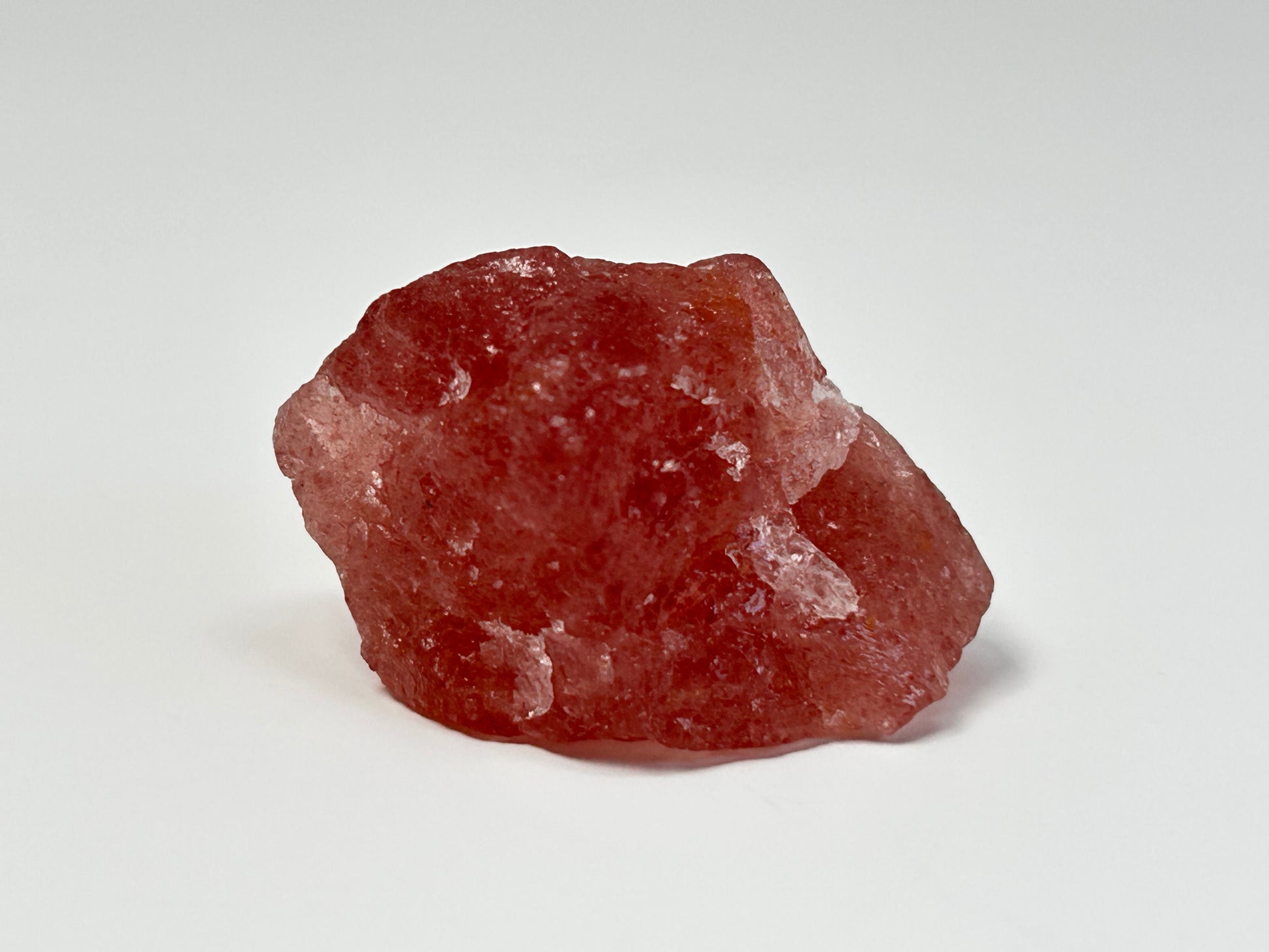Natural Cherry Tanzurine Quartz for meditation and energy work with white background.