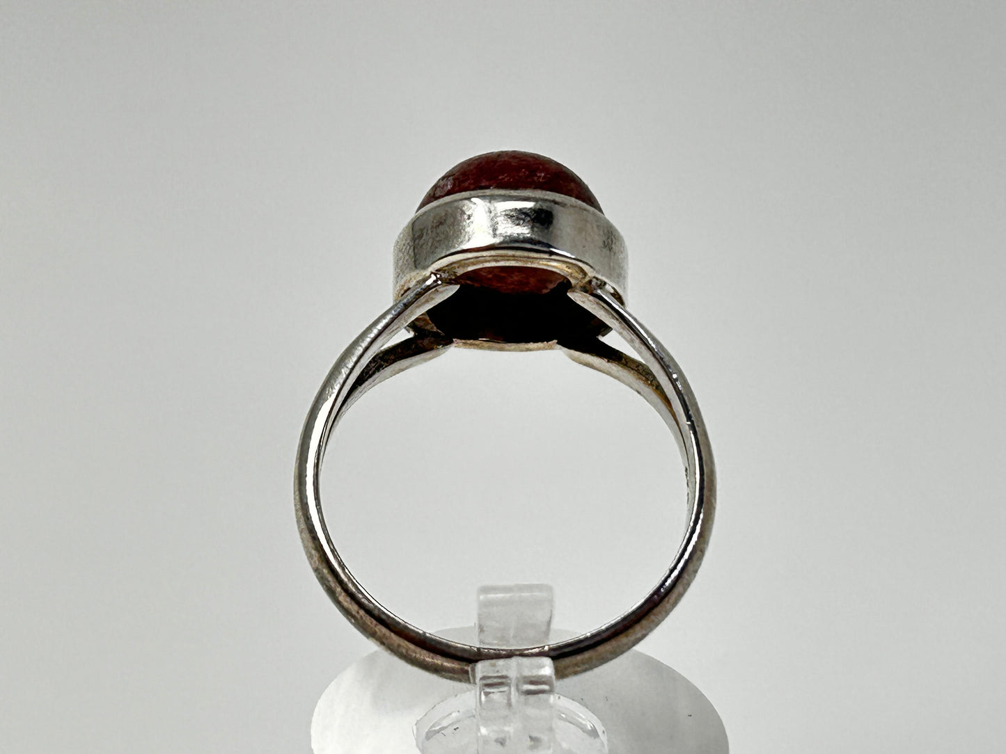 Cherry Tanzurine Sterling Silver Ring for natural grounding on table with white background. 
