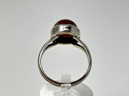 Cherry Tanzurine Sterling Silver Ring for natural grounding on table with white background. 