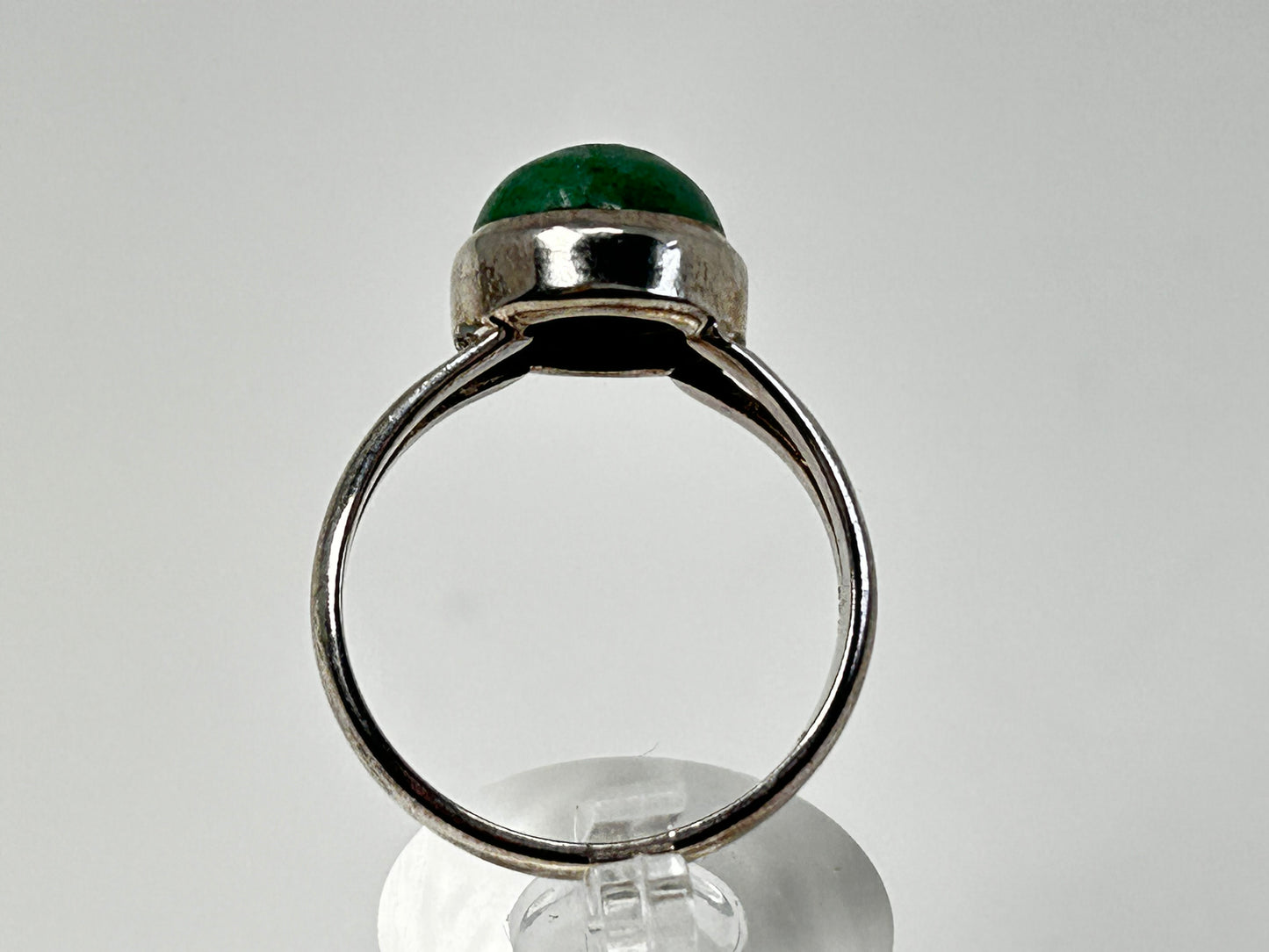 Emerald Tanzurine Sterling Silver Ring on table top with white background