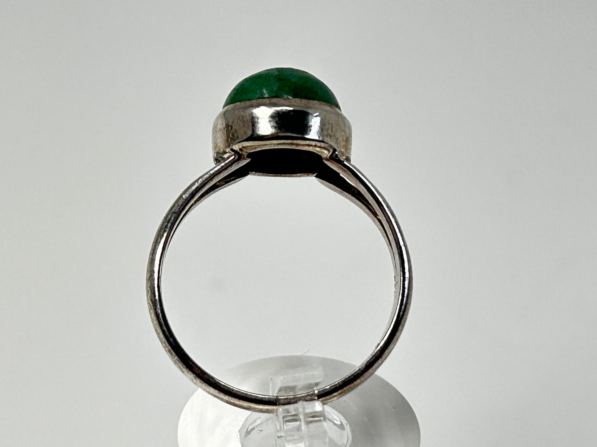 Emerald Tanzurine Sterling Silver Ring on table top with white background