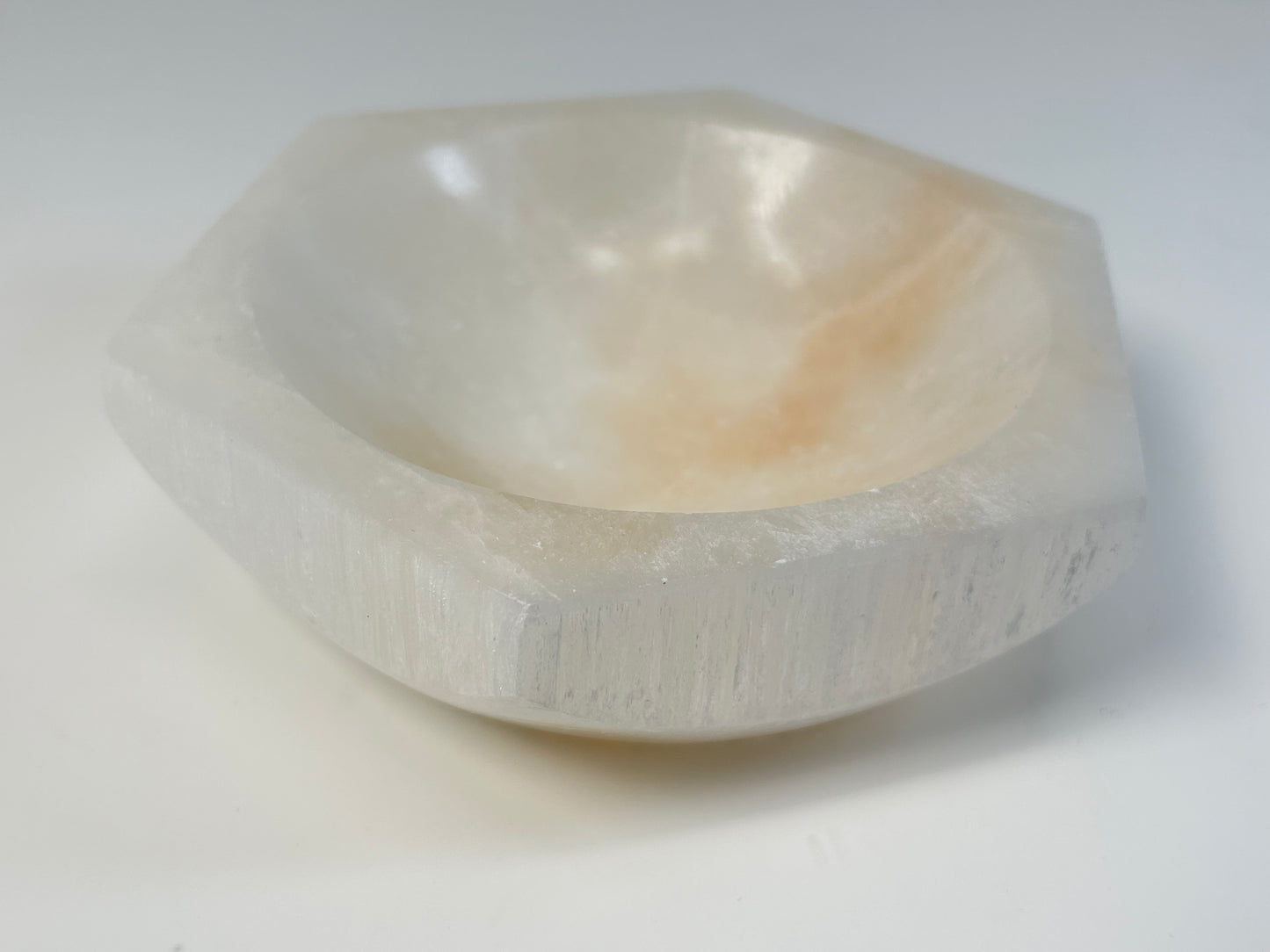 Polished Light-filled Octagon Selenite Bowl on a white background