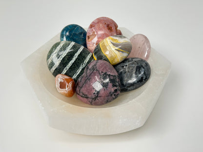 Collection of multicolored crystals on a Light-filled Octagon Selenite Bowl