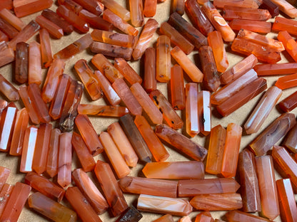 Mini Carnelian Crystal Towers for energy and trust on natural background