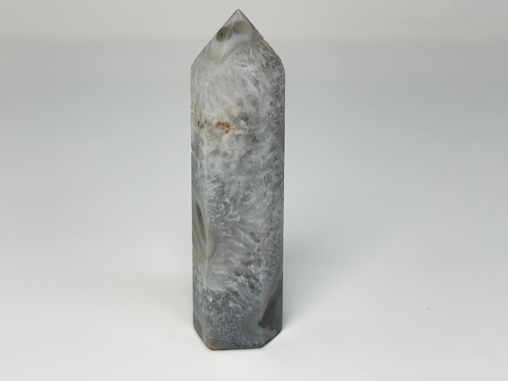 Moss Agate Crystal Tower on a white background