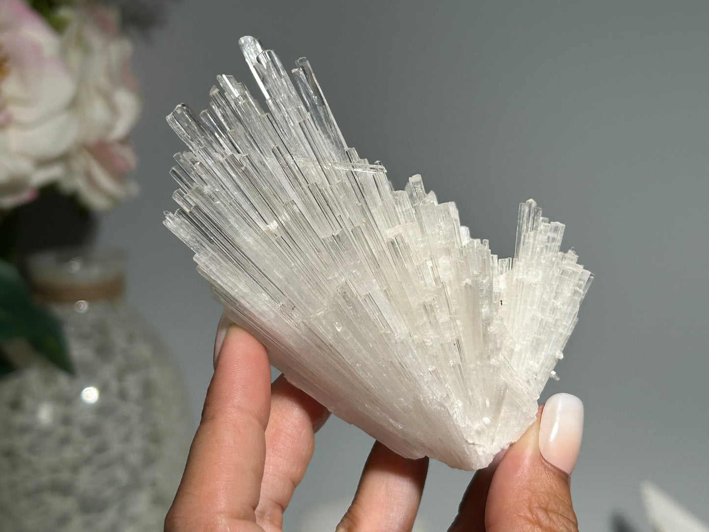 Hand holding a Lightworker’s Stone with High vibrational energy and Profound peace Calming and relaxing everything in the foreground