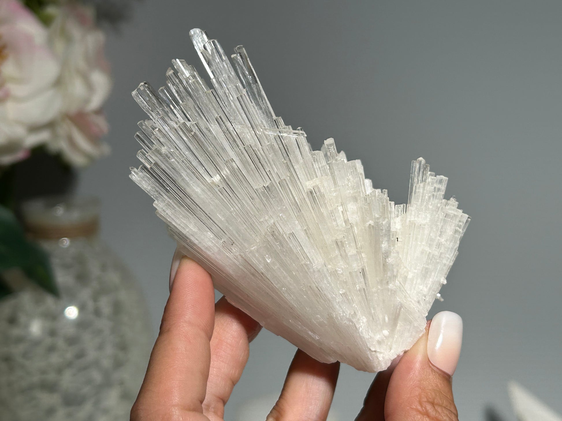 Hand holding a Lightworker’s Stone with High vibrational energy and Profound peace Calming and relaxing everything in the foreground