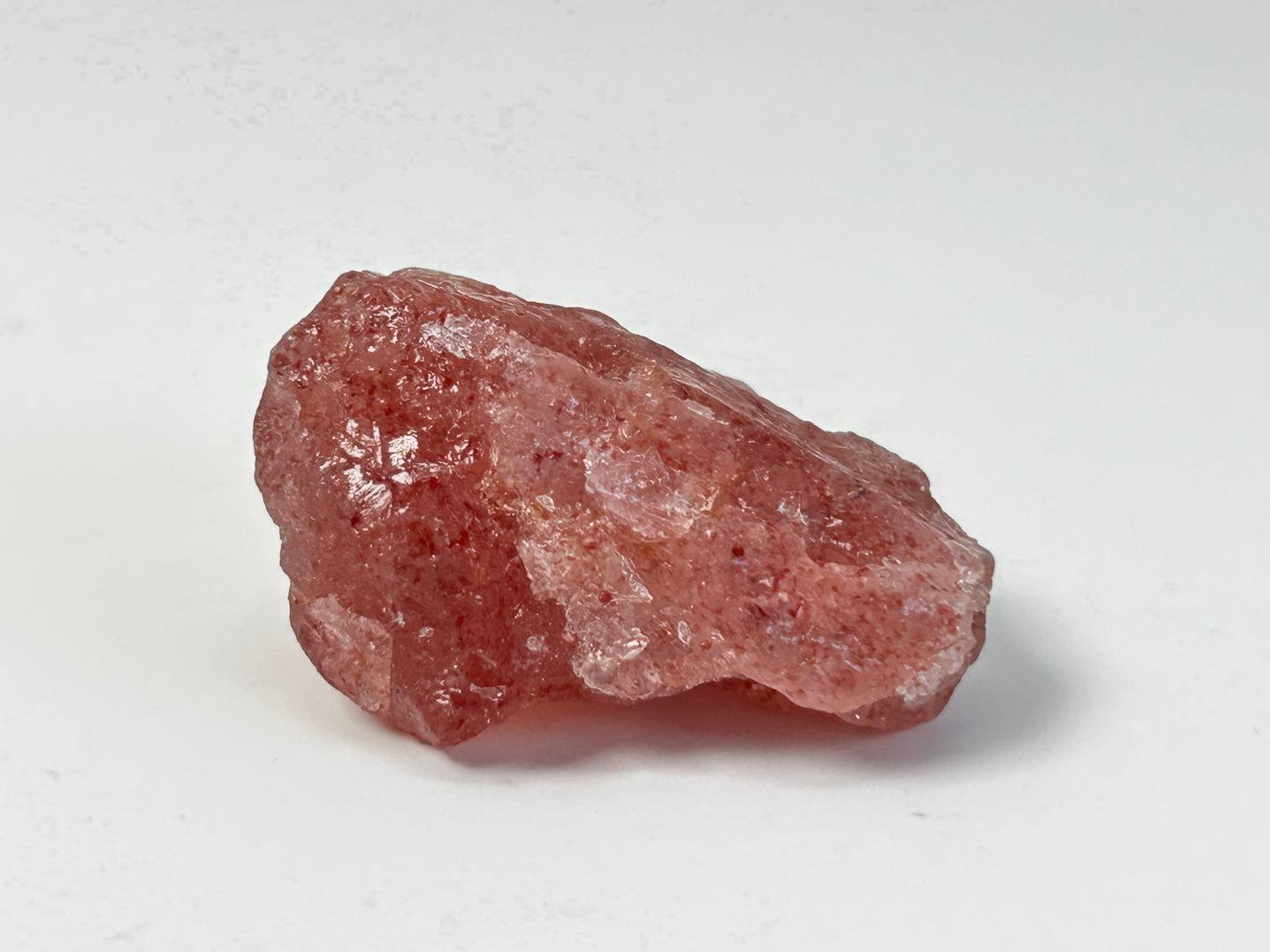 Natural Cherry Quartz Tanzurine Chunk for meditation and energy work with white background.