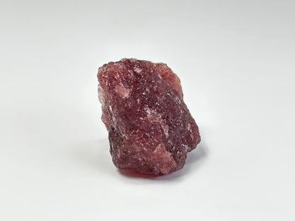 Natural Cherry Tanzurine Chunk on table top with white background