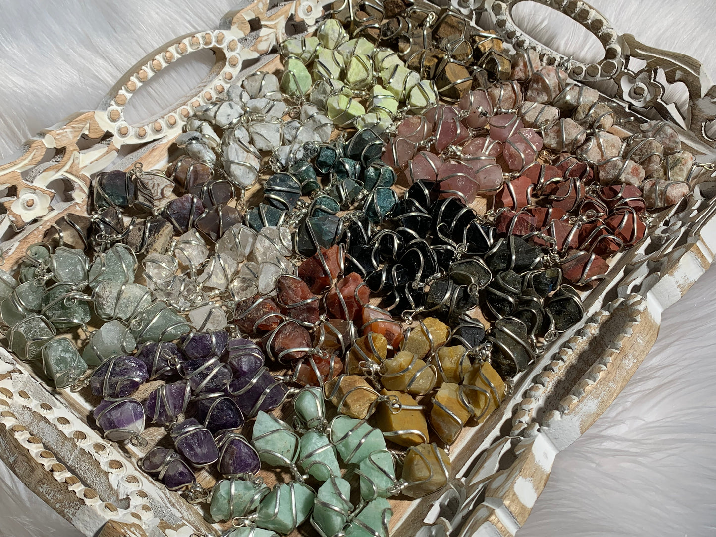 Raw Crystal Pendants That Call to You for meditation and energy work displayed on table