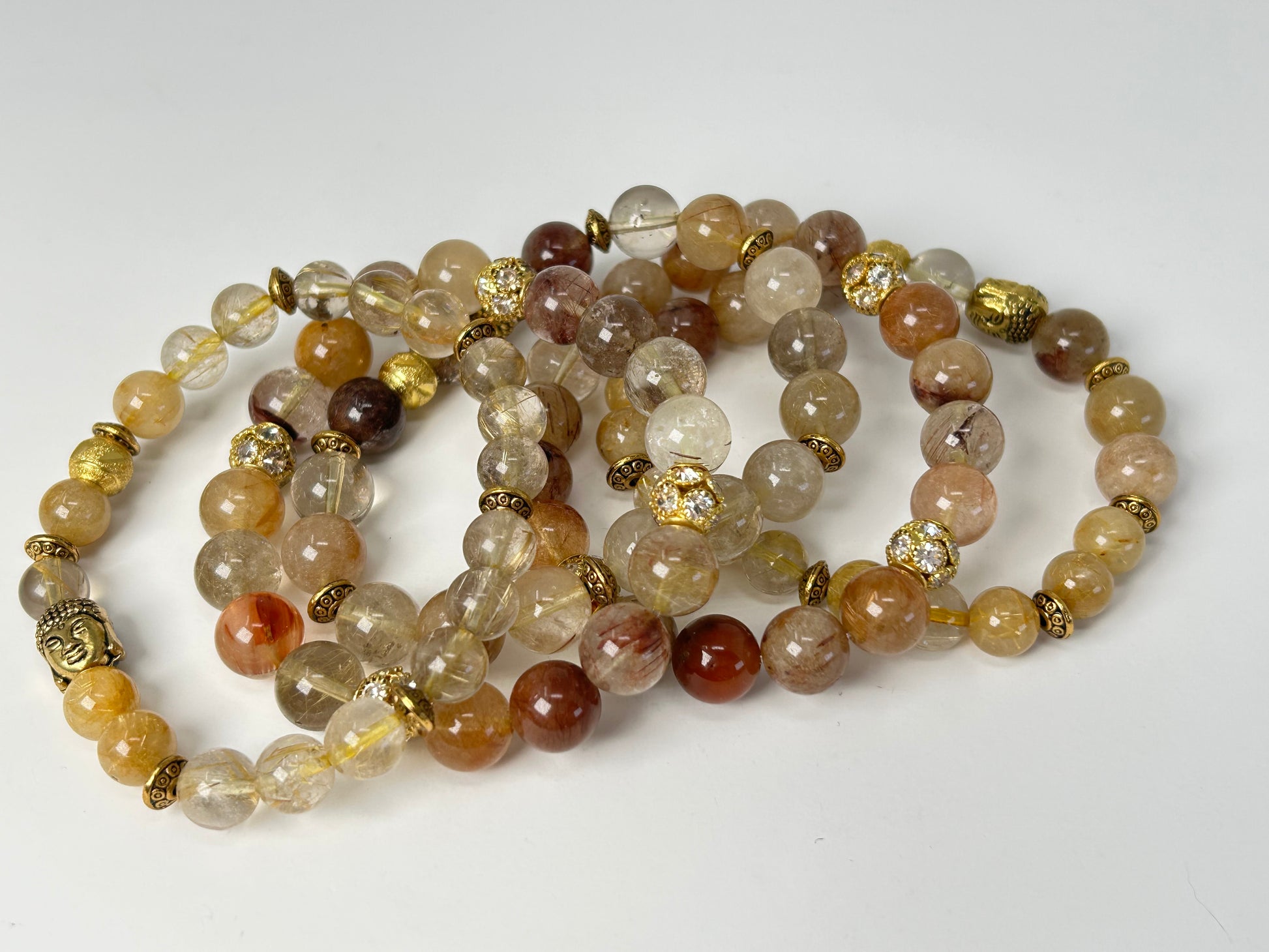 Set of 5 Rutile Quartz Bracelets on a white background