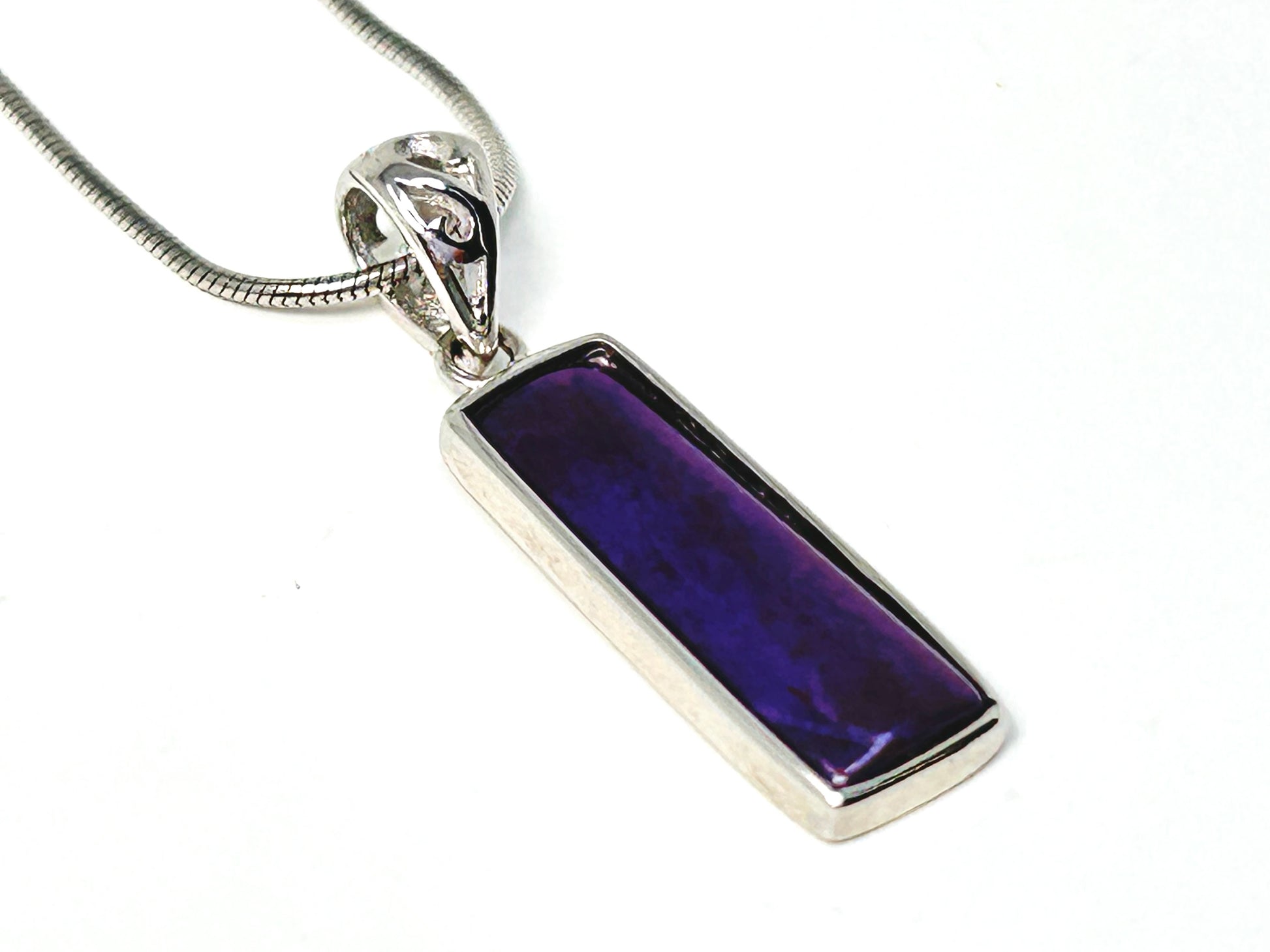 Sugilite Sterling Silver Pendant for meditation and energy work on white background