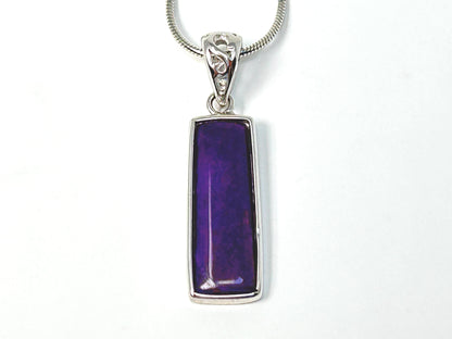 Close up of a Sugilite Sterling Silver Pendant for aura cleansing gemstone reiki energized with white background