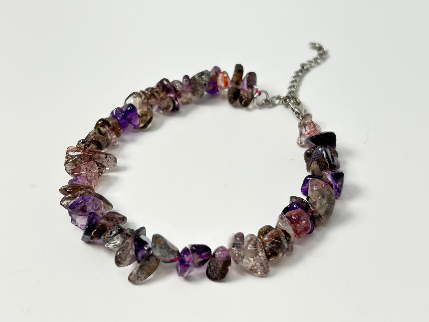 Multi-colored Super 7 Chip Bead Bracelet for natural grounding on table with white table-top