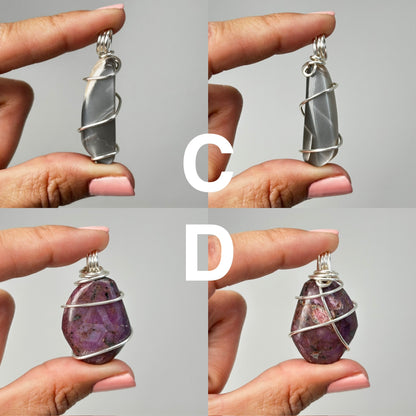 Hands holding Wire Wrapped Crystal Pendants ethically sourced natural healing for meditation over white background.