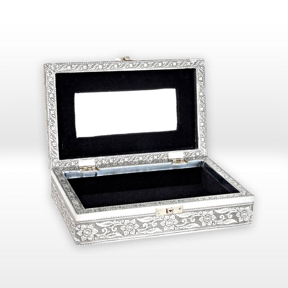 Decorative jewelry box with silver embellishments on a white background